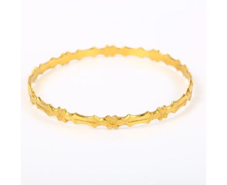 An Eastern unmarked high carat gold bangle, band width 5.2mm, internal diameter 5.5cm, 14.1gNo damage or repairs, only light 