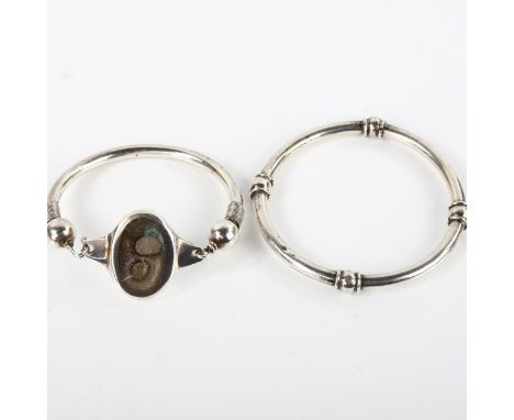 2 mid-20th century bracelets, comprising Mexican silver and unmarked examples, plain internal diameter 6cm, 72.1g total (2)No