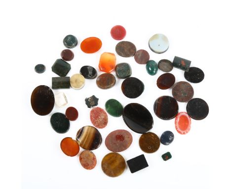 A group of unmounted hardstone seals and ring panels, gemstones include bloodstone, sardonyx, carnelian, banded agate etcLot 
