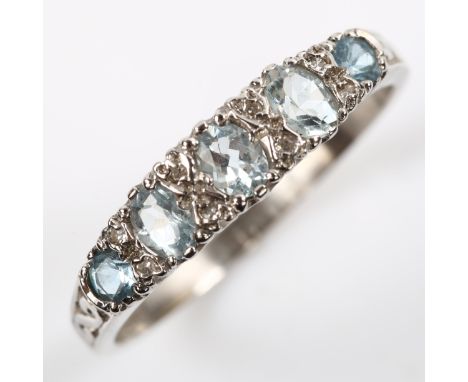 A 9ct white gold graduated five stone topaz and diamond half hoop ring, setting height 4.9mm, size S, 2.2gNo damage or repair
