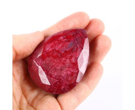 A large unmounted 444.25ct pear-cut ruby, 53.60mm x 41.00mm x 21.75mm, with GLI report cardNo damage 