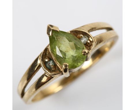 A 9ct gold peridot and cubic zirconia dress ring, setting height 8.7mm, size N, 2.4gNo damage or repairs, all stones present,