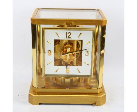 JAEGER LECOULTRE - a gilt-brass Atmos clock, square white lacquered dial with quarterly Arabic numerals and glass panelled ca