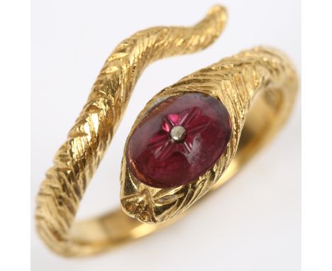 An 18ct gold figural coiled snake/serpent ring, the textured head set with etched cabochon garnet, setting height 11.4mm, siz