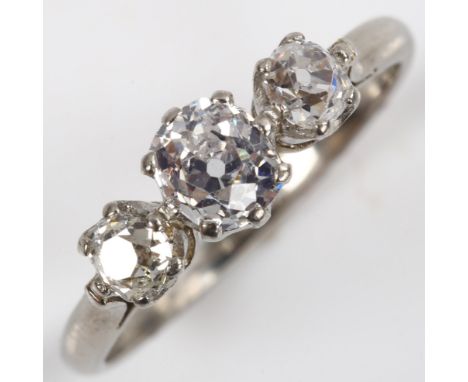 A late 20th century platinum three stone diamond ring, claw set with old-cut diamonds, principal diamond approx 0.5ct, total 