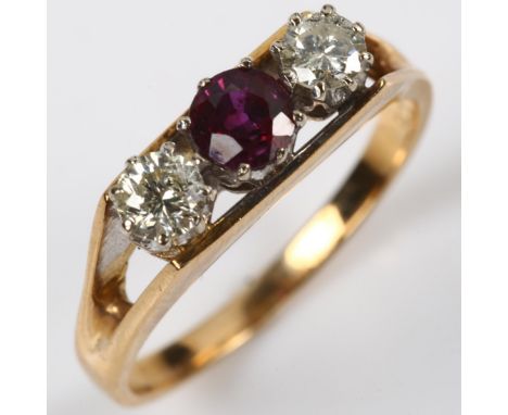 An 18ct gold three stone ruby and diamond ring, set with round-cut ruby and modern round brilliant-cut diamonds, total diamon