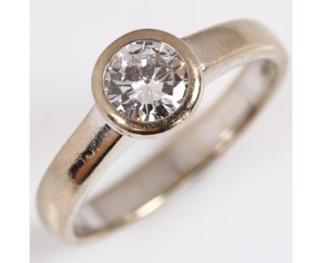 An 18ct white gold 0.5ct solitaire diamond ring, bezel set with modern round brilliant-cut diamond, colour approx G/H, clarit