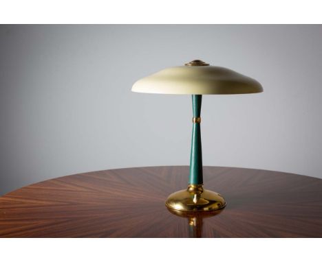 A BEDSIDE LAMP, ITALIAN, by LUMI OF MILAN, with adjustable swivel shade, on circular gilt base, bearing label, 40cm high