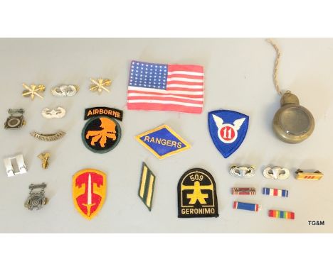 Collection of US and other military badges and insignia flashes and compass case