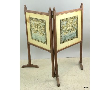 A Chinese embroidered fire screen