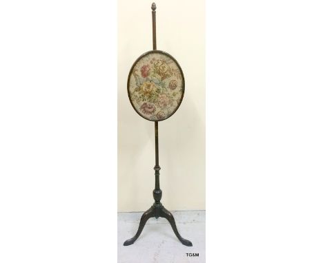 A mahogany and tapestry pole screen. 144 x 32cm