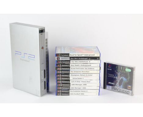 PlayStation PS2 console (Satin Silver) and 14 PlayStation games. Games inlcude: Alien Trilogy (PS1) [Platinum], The Simpsons 