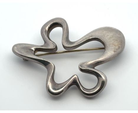 A Georg Jensen Danish silver 'Splash' brooch designed by Henning Koppel (Danish, 1918-1981), pattern No 321. Dimensions 48mm 