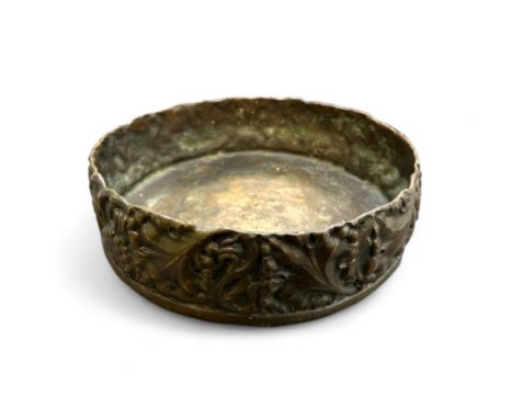 A heavy embossed bronze tray or large dish, diameter approx. 23cm. 