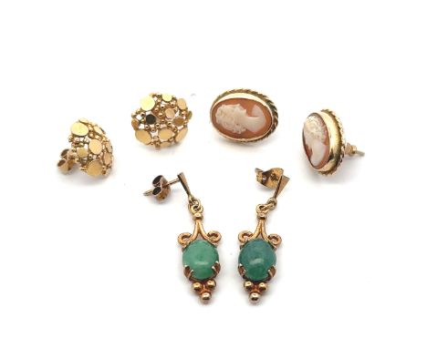 Three pairs of 9ct gold earrings including a pair of cameo set earrings and a pair of green stone set earrings, probably jade