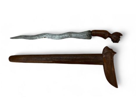 Indonesian Kris / Keris, with carved wooden scabbard and carved head handle, wavey blade. Blade length 33.5cm, overall length