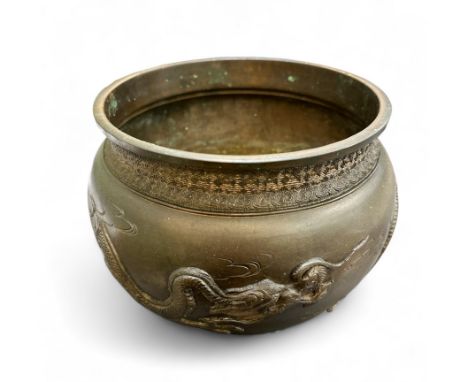 A Japanese bronze jardiniere / planter with 3 clawed dragon design. Diameter of rim approx. 18.5cm.