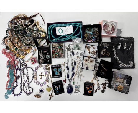 Large quantity of costume and silver jewellery. Includes a silver and ruby necklace, silver pendants necklaces, earrings, har