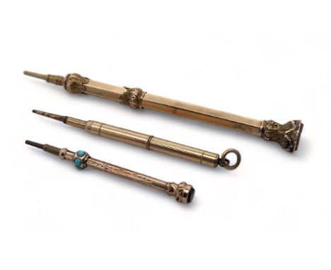 Three propelling pencils: Includes an unmarked 9ct gold pencil with agate termination, 11cm in length, 12.44g. Also two small
