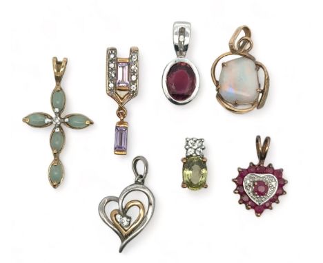 Seven 9ct gold and gem set pendants. Includes pink tourmaline, diamond, ruby and diamond, amethyst and white topaz, Mali garn