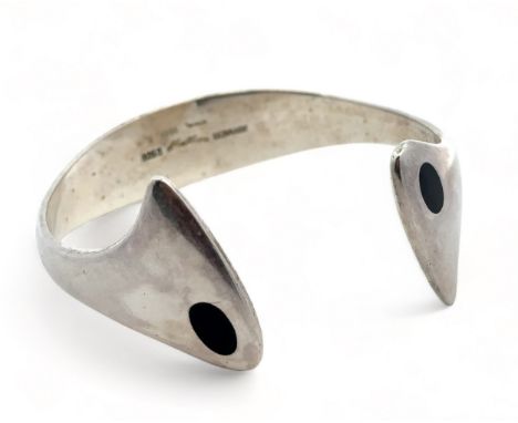 A Hans Hansen Danish modernist silver and black enamel torque bangle, designed by Bent Gabrielsen, pattern No. 213e. Signed a