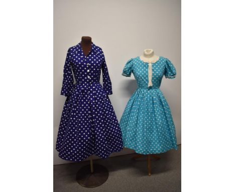 Two 1950s blue spotty cotton dresses, both having full pleated skirts, dark blue dress has button and press stud fastening to