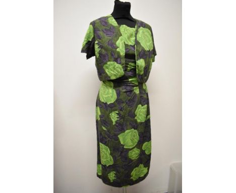 A 1950s abstract rose print dress and bolero jacket, dress having gathers to hip and bow detail and side metal zip, jacket ha