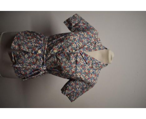 A very pretty 1940s medium weight cotton floral blouse, having buttons to front and tie fastening to waist.