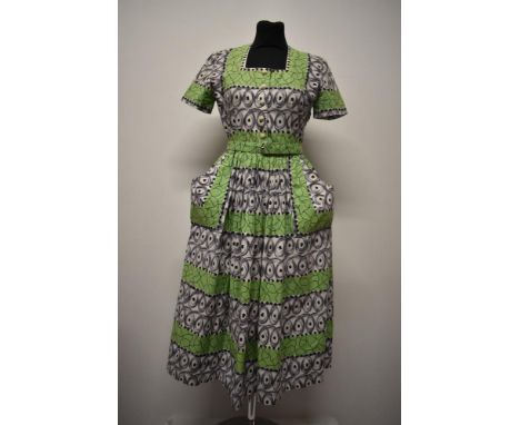 A scarce late 1940s Blanes cotton day dress with novelty print, square neckline, short sleeves, buttons to front, self covere