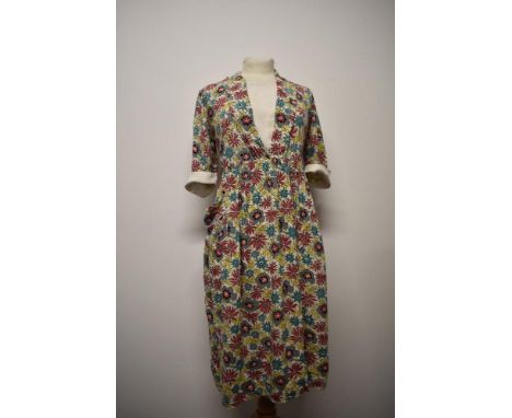 A 1940s vibrant floral linen/ linen look day dress, having modesty panel to bodice, turn up contrasting cuffs and pocket to s