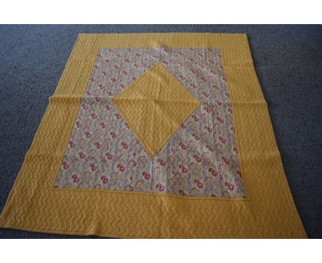 A 1930s/40s 'The Comfy' quilt, having paisley diamond to centre with block yellow surround and paisley border, large size, ve