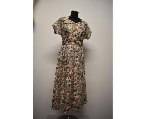 A 1940s gossamer fine silk novelty print day dress, having large collar, self covered buttons, cap sleeves and side metal zip
