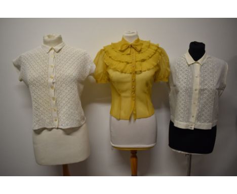Three 1940s to 1950s blouses, including crocheted blouse and mustard yellow blouse with ruffles to yolk.