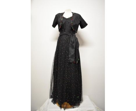 A decadent Art Deco 1930s evening gown with matching bolero and sash belt, fashioned from black taffeta and having a layer of