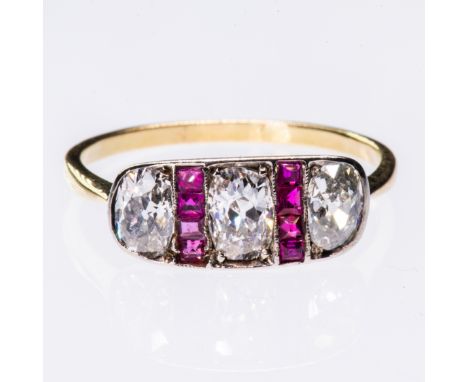 A LATE 19TH CENTURY RUBY AND DIAMOND RING, the rectangular plaque mount set with three old oval cut diamonds alternately set 