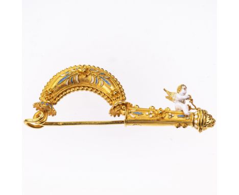 AN ANTIQUE ENAMEL FIBULA, in Roman revival style, with seated white enamelled Cherub to the fibula with blue floral enamel de