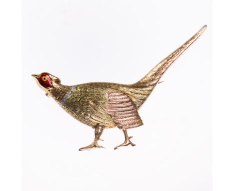 A YELLOW METAL AND ENAMEL BROOCH, modelled as a pheasant of textured metal and red enamelling, on brooch pin fitting. Width 6
