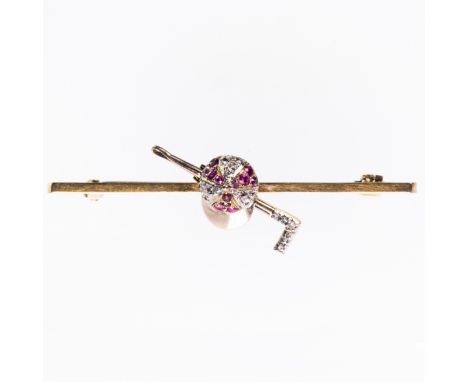 A DIAMOND AND RUBY SET BROOCH, set to the centre of the rectangular bar with a riding crop and jockey hat, set with subtle ru