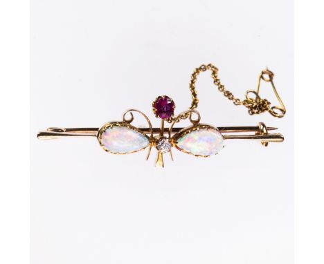 A VICTORIAN OPAL BAR BROOCH, the two oval opals and single ruby and diamond highlights set in floral formation to the centre 