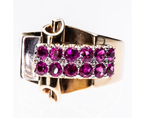 A 1970'S RUBY SET COCKTAIL RING, in Van Cleef and Arpels style, of two rows of six ruby highlights set on a structured moulde