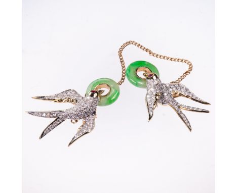 A JADEITE AND DIAMOND DOUBLE BROOCH, modelled as two birds in flight set throughout with diamond highlights, single ruby high