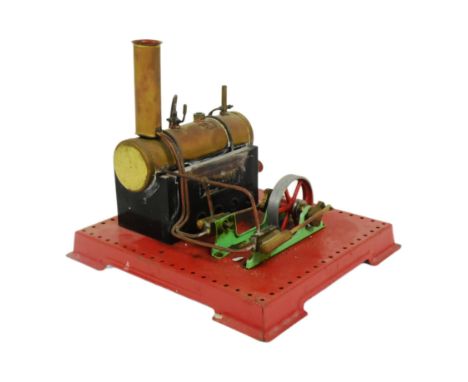 A vintage Mamod stationary steam engine plant No. SE3 comprising of horizontal copper and brass boiler powering a twin oscill