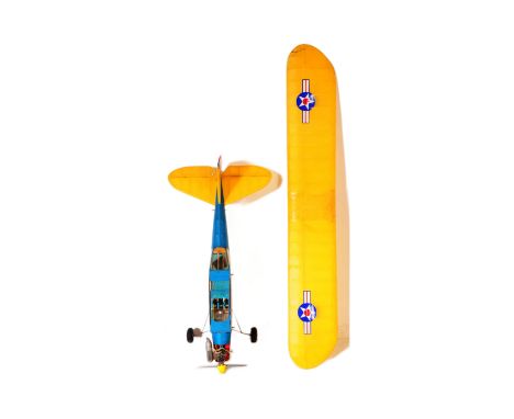 Radio Controlled Plane - a vintage model RC plane fuselage and wings. Fitted with front engine, propellers and radio gear. Wi