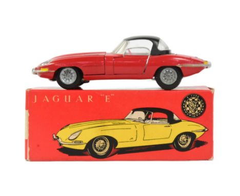 Diecast - an original Tekno (Denmark) made diecast model Jaguar E-Type. Red exterior with opening roof and bonnet. Housed wit