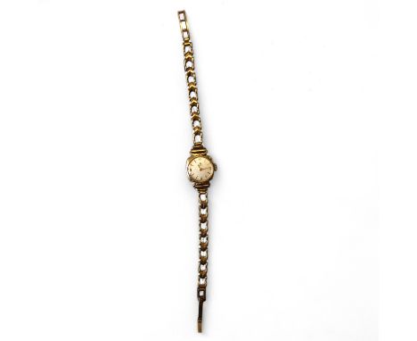 Ladies 9ct Yellow Gold Hallmarked Tissot Manual Bracelet Wristwatch.  13mm case with baton and Arabic numerals  Gross Weight: