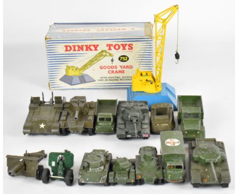 Thirteen vintage Dinky Toys diecast model military vehicles together with a Goods Yard Crane, 752, in original box.