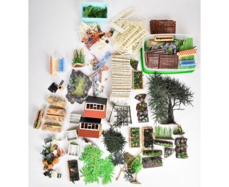 A collection of Britains Flora Garden including raised beds, garden furniture, tools, fences and trees etc.