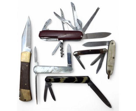 Pocket knives - a Rodgers Cutlers, Sheffield pocket knife, brass linings, mother of pearl scales; a three bladed pocket knife