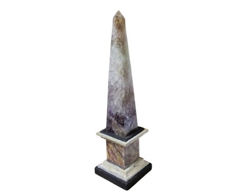 A Grand Tour type amethyst quartz  library desk obelisk, wooden square base,  28cm high