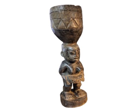 Tribal Art - a Pende/Yaka people of the Democratic Republic of Congo hardwood figural mortar, 60cm high